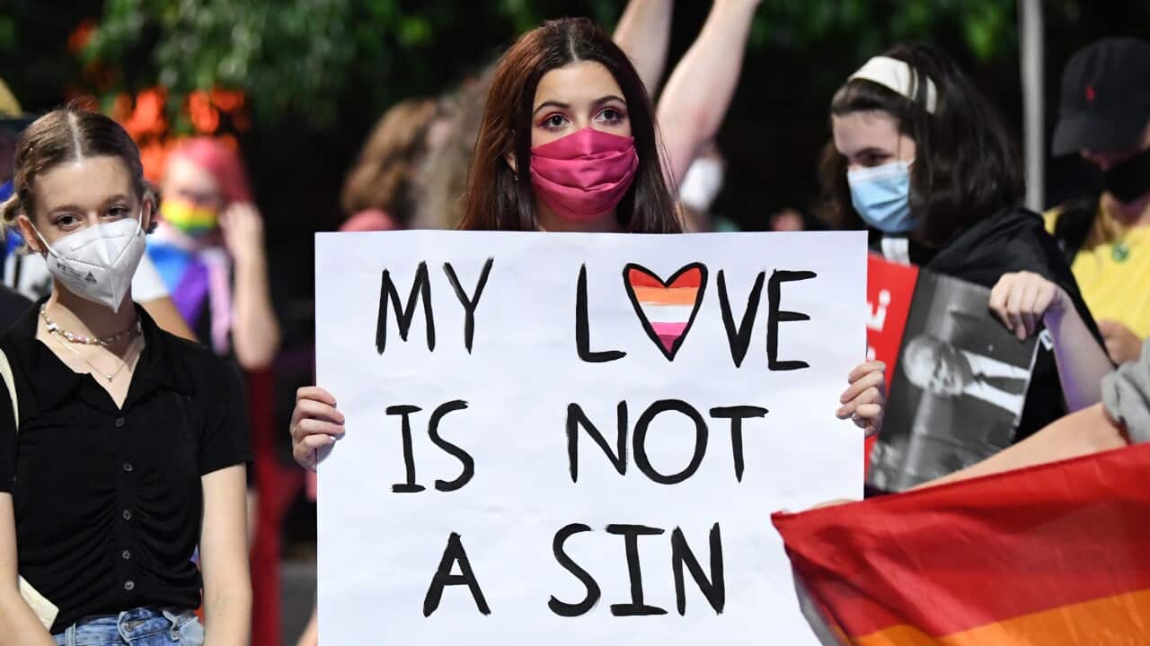 Supporters and members of the LGBTIQ+ community are seen protesting against Citipointe Christian College during a rally in King George Square in Brisbane
