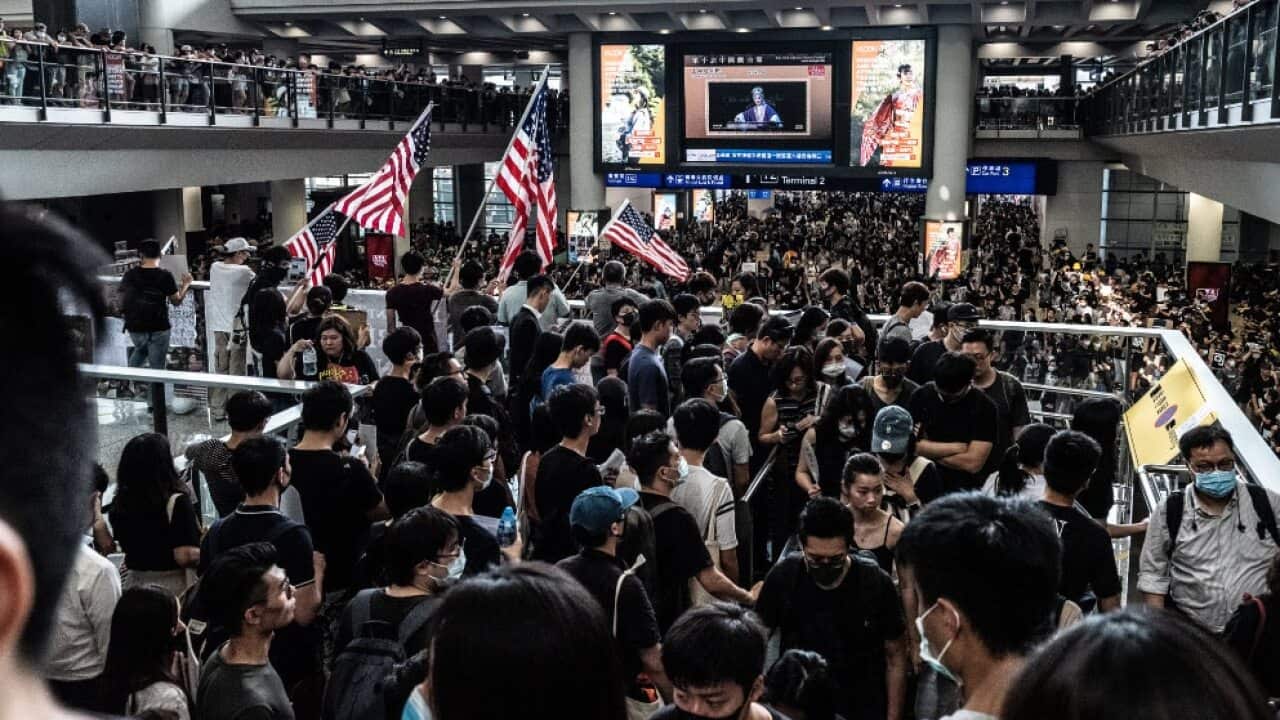 Thousands of protesters descend on the Hong Kong International Airport in Hong Kong on August 12, 2019 to protest the police treatment of protesters