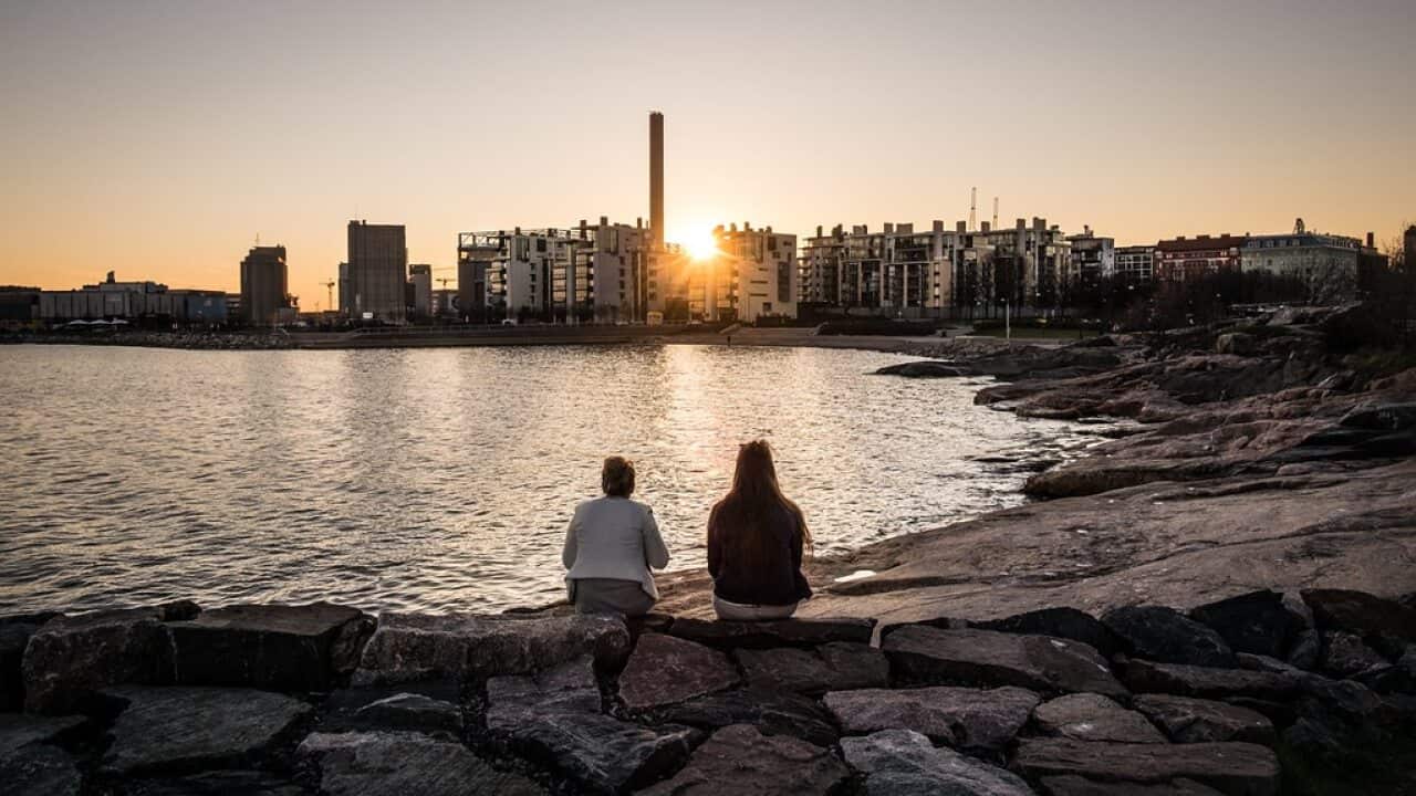 "Looking at sunset - Helsinki, Finland - Color street photography" by Giuseppe Milo (www.pixael.com) is licensed under CC BY 2.0