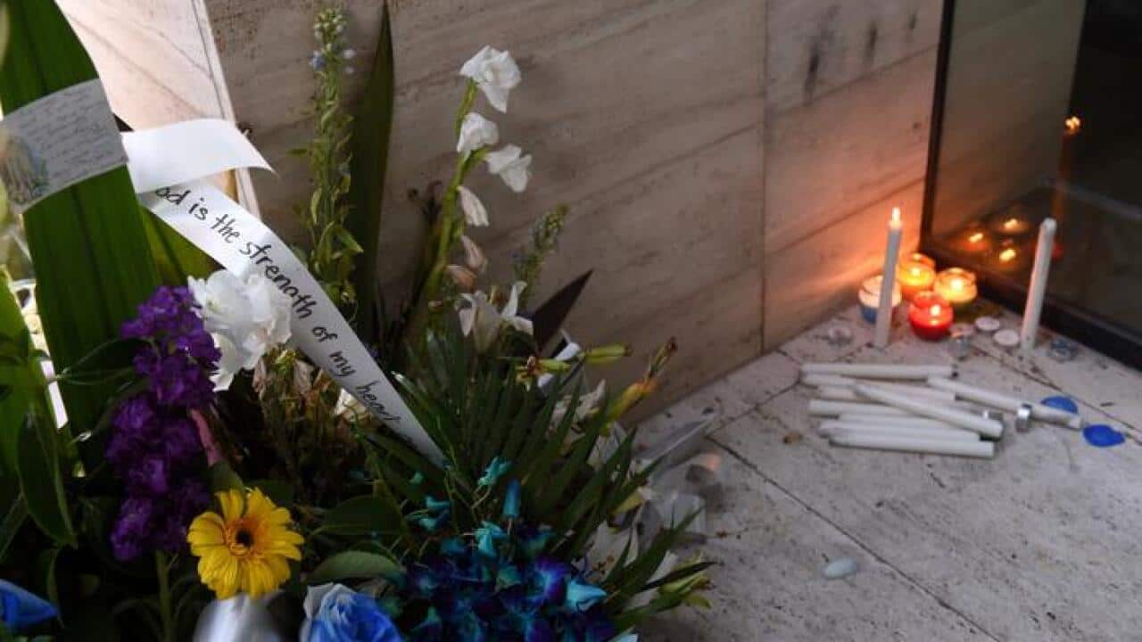 A vigil for police worker Curtis Cheng