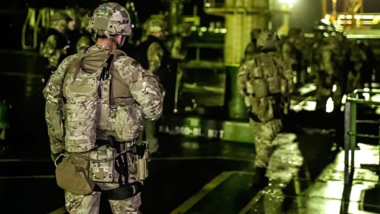 British Royal Marines seizing an Iranian oil tanker off Gibralter.