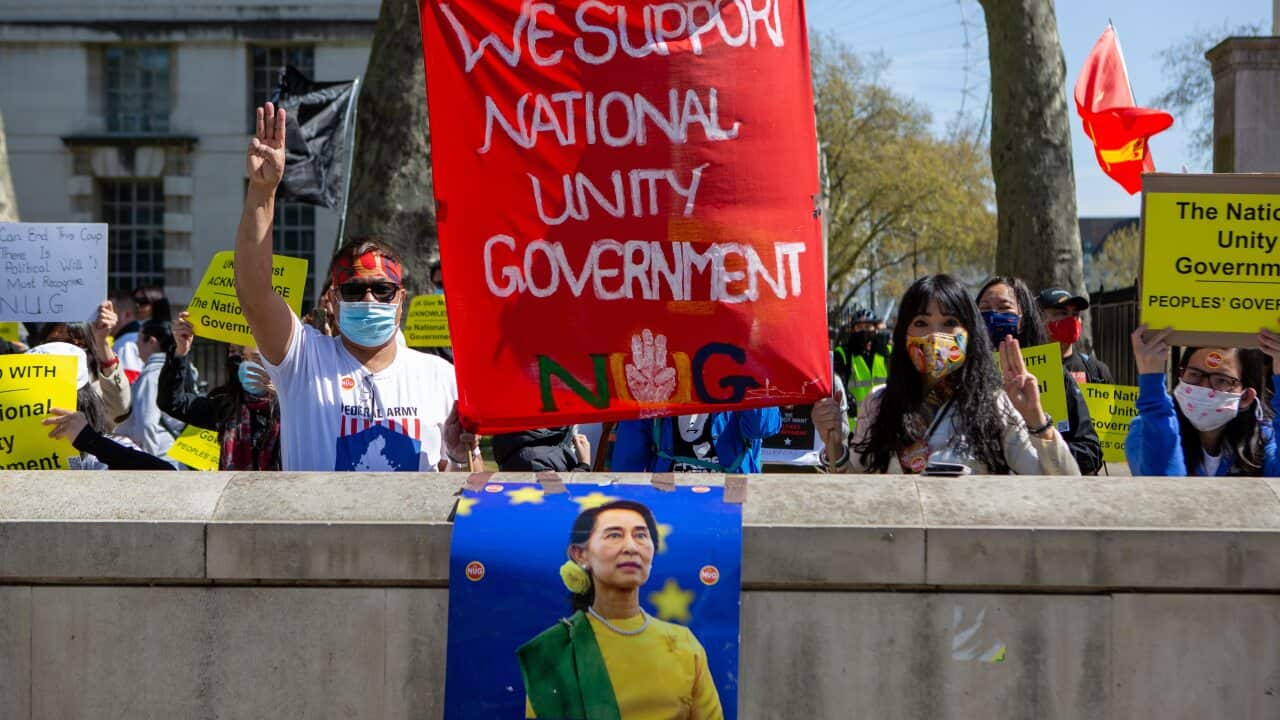 Protesters hold placards during a peaceful demonstration in London against the Myanmar coup