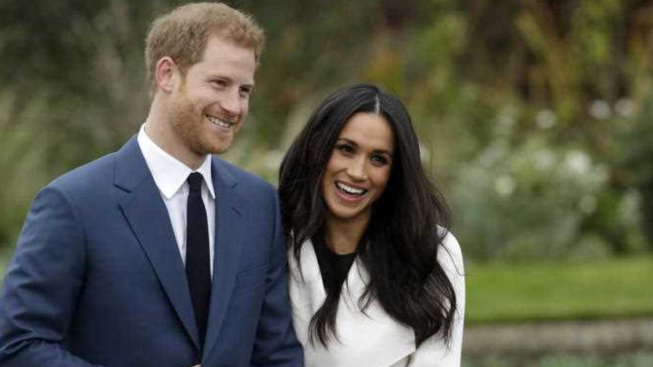 Britain's Prince Harry and his fiancee Meghan Markle pose for photographers during a photocall in the grounds of Kensington Palace in London, Monday Nov. 27, 2017.
