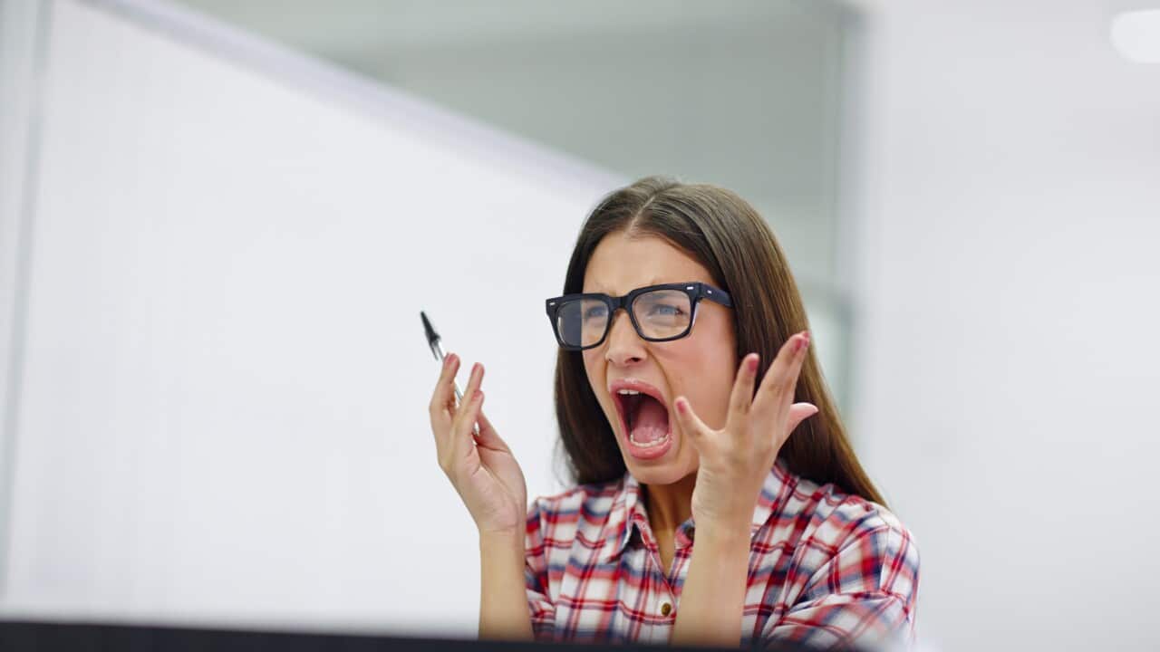 A young woman is screaming.