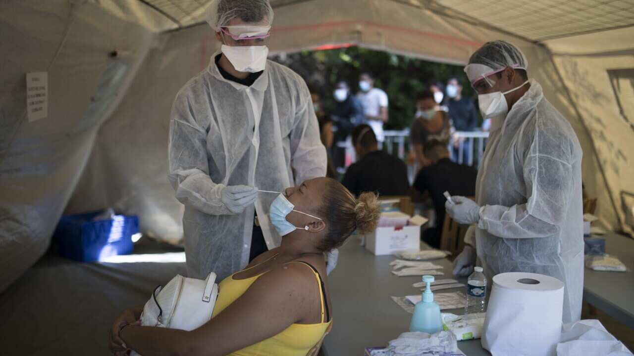 A woman is tested for COVID-19 at a mobile testing centre in Marseille, France, Thursday.