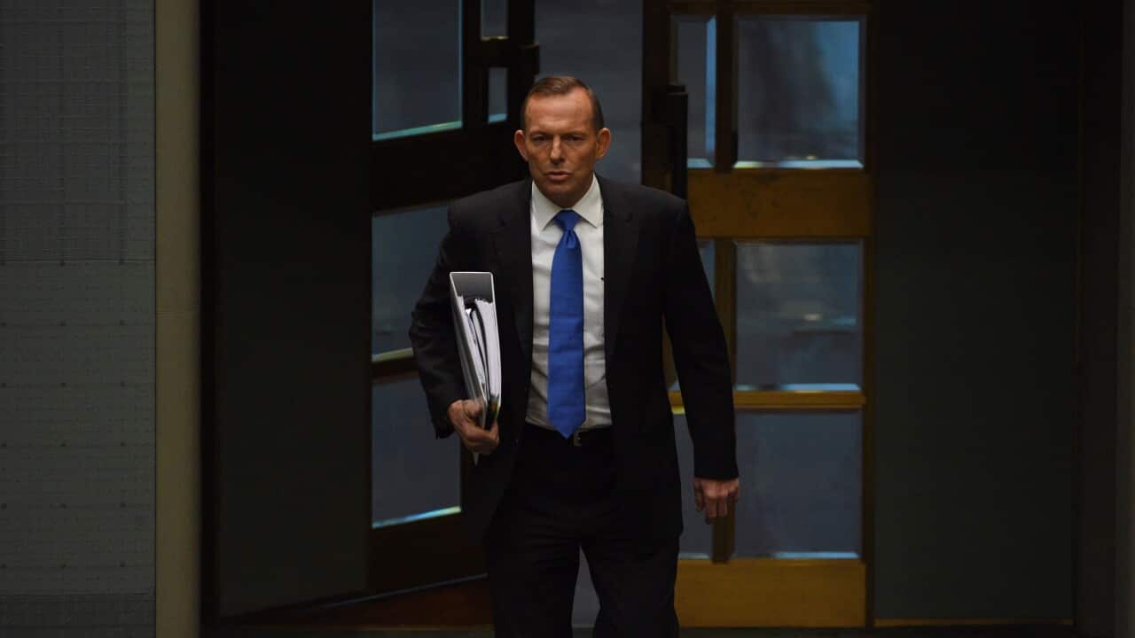 Australian Prime Minister Tony Abbott arrives for Question Time in the House of Representatives at Parliament House in Canberra, Tuesday, Aug. 18, 2015. (AAP Image/Mick Tsikas) NO ARCHIVING
