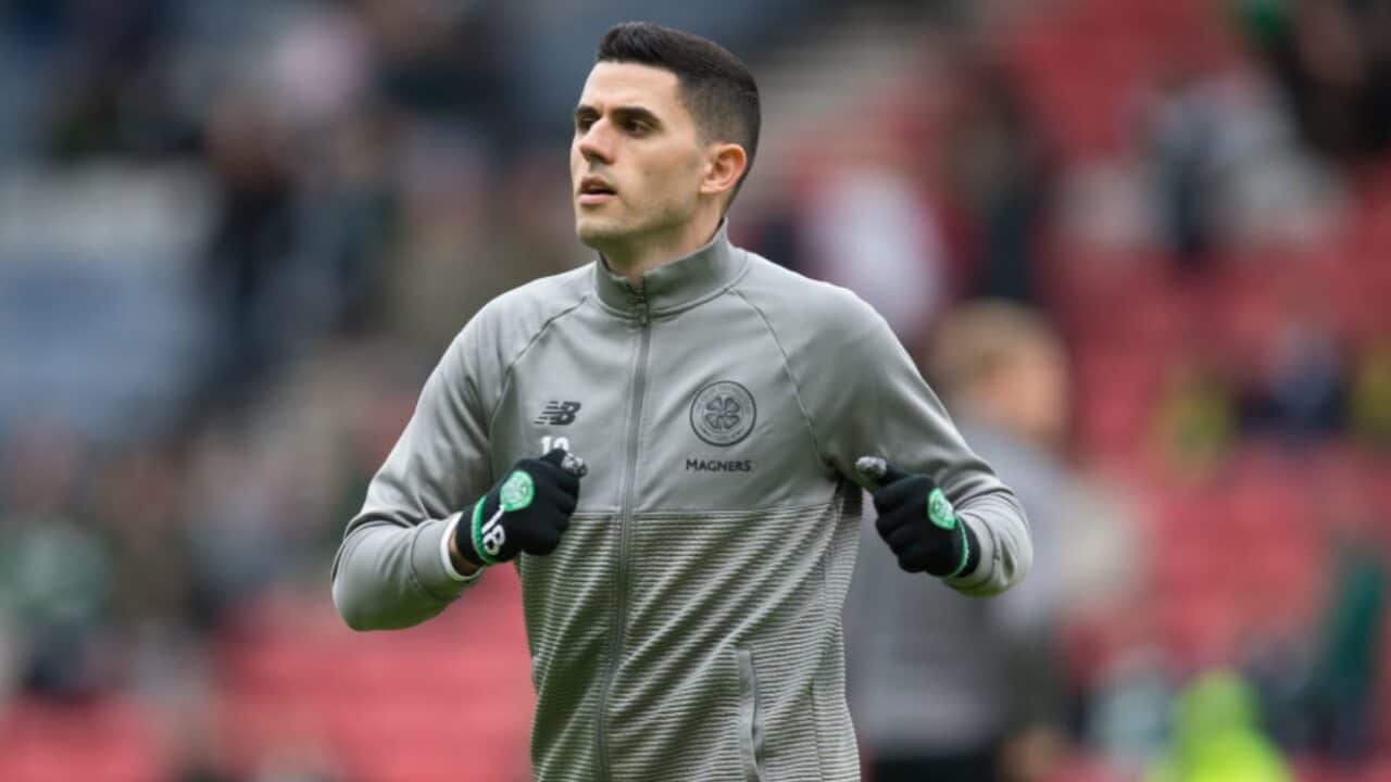 Tom Rogic warms up before a Celtic match