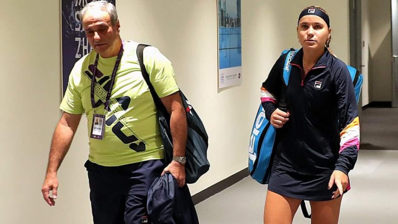 Sofia Kenin of the US walks onto the court from the tunnel with her coach and father Alex Kenin on Day Six of the 2019 Shiseido WTA Finals in Shenzhen, China