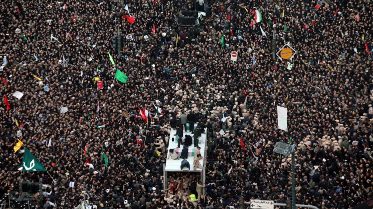 Iranians carrying the coffin of late Iranian general Qasem Soleimani in the city of Mashhad