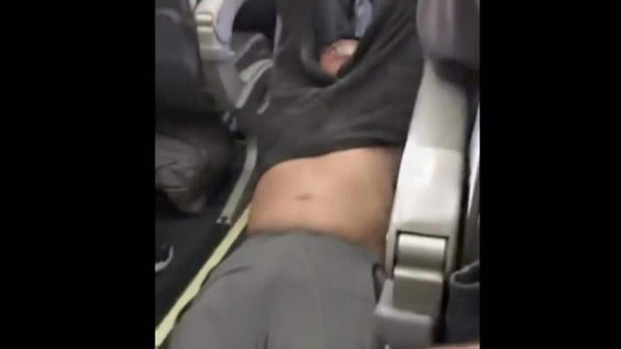 Video of police officers dragging a passenger from an United Airlines flight is sparking uproar. (AAP)