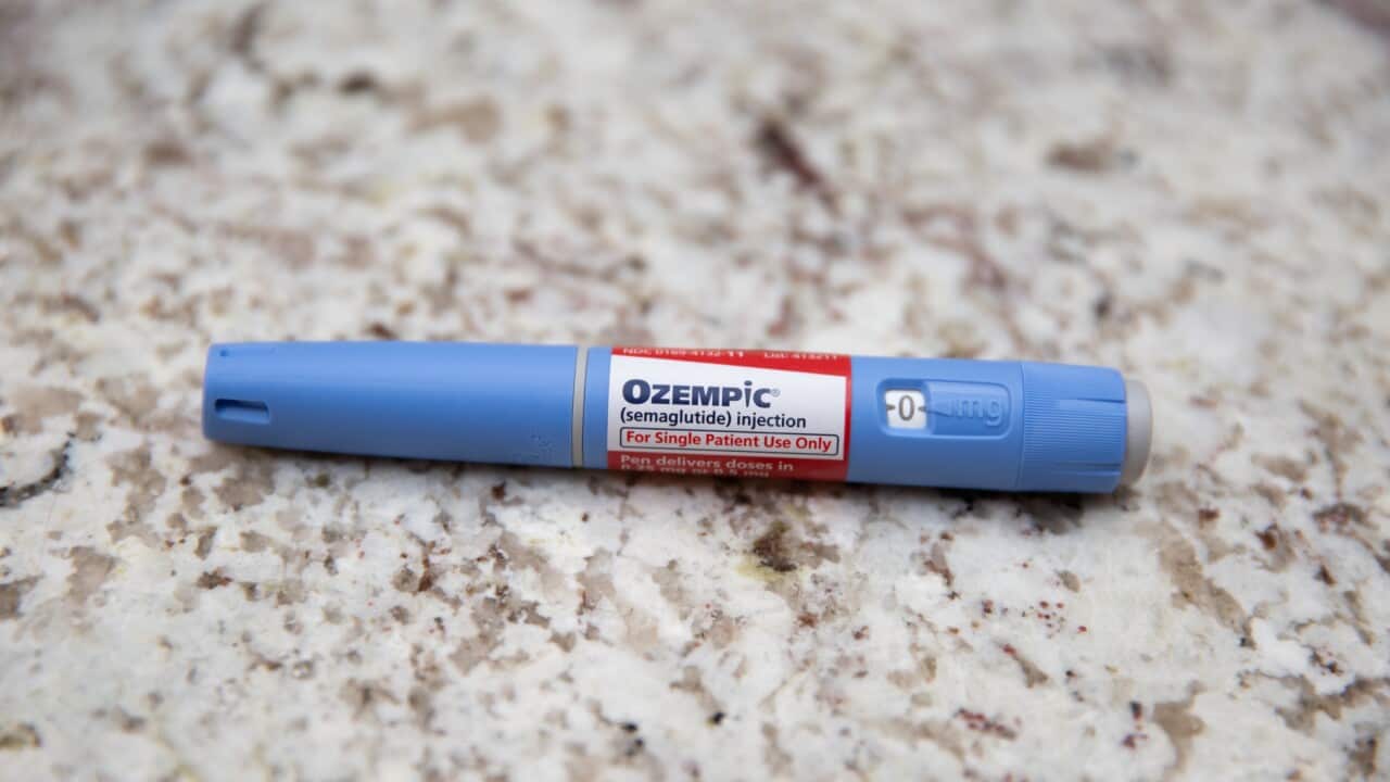 A blue pen-like device