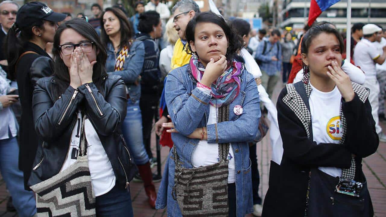 Supporters of the peace accord signed between the Colombian government and FARC, follow on a giant screen the results of the referendum.