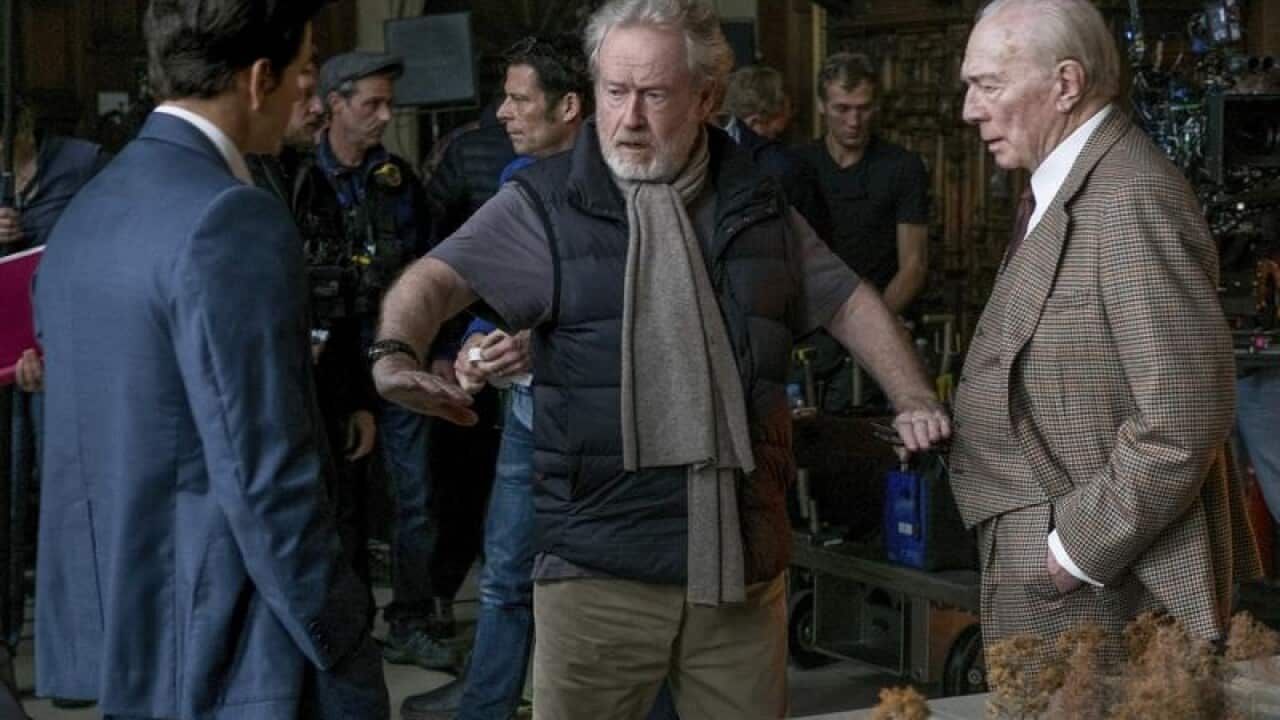 Mark Wahlberg (L) and Christopher Plummer (R) with Ridley Scott.