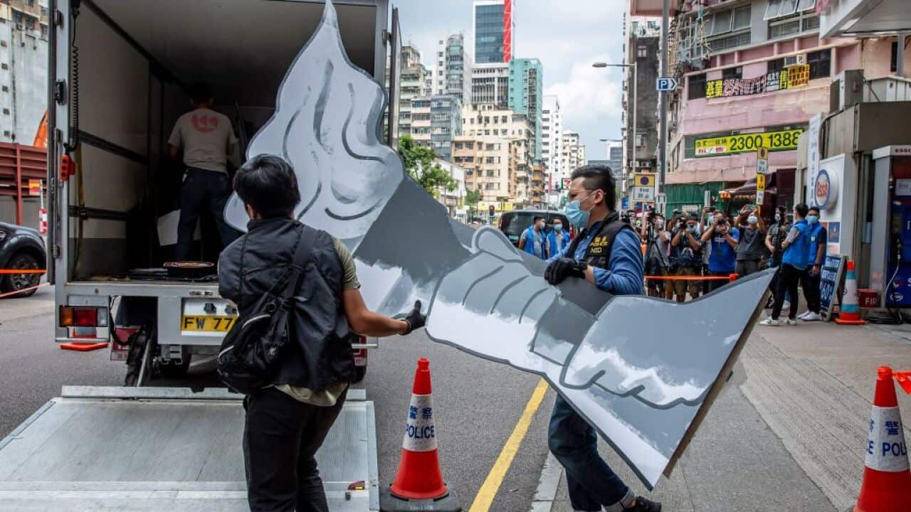 Police officers from the National Security Department take away items after raiding the 'June 4' museum in Hong Kong on 9 September, 2021.