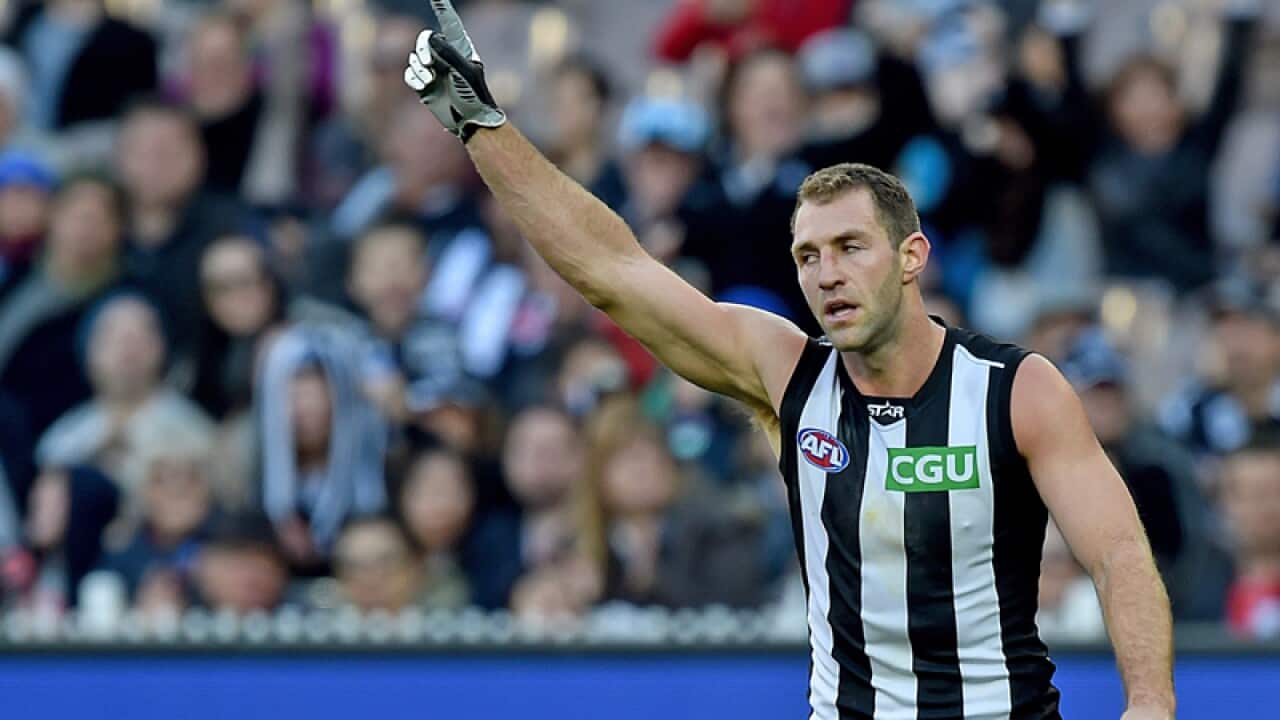 Travis Cloke of the Magpies celebrates
