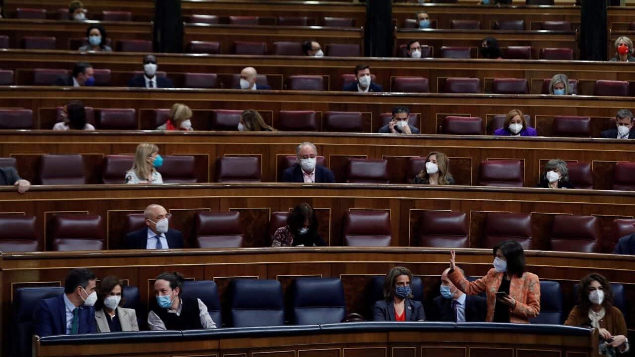 Spanish Prime Minister Pedro Sanchez chats with first Deputy Prime Minister Carmen Calvo and second Deputy Prime Minister Pablo Iglesias during question time.