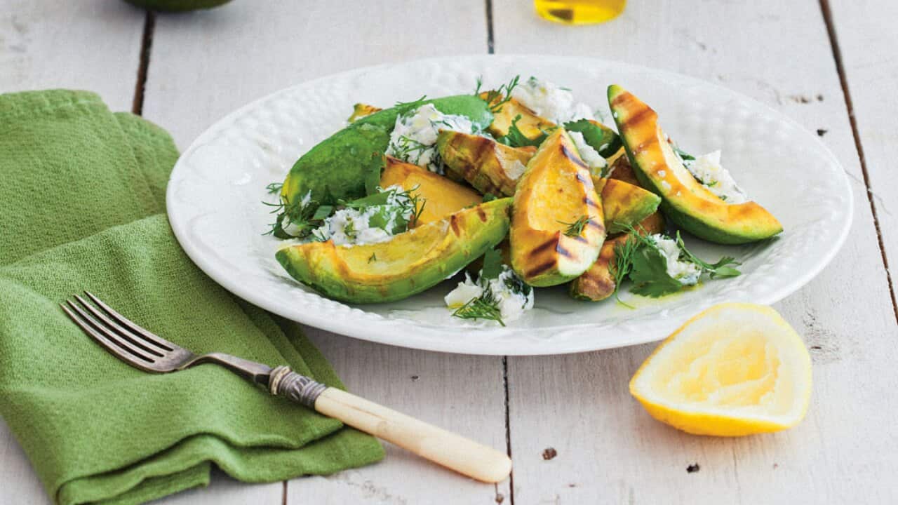 Barbecued avocado with herb labneh salad