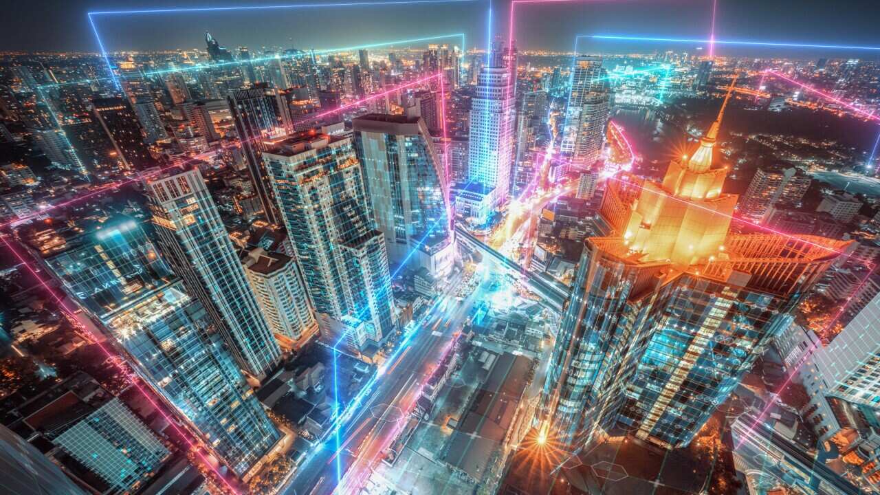 Night cityscape with Neon light and Futuristic digital design, Smart city and Metaverse virtual reality concept, data network connection concept