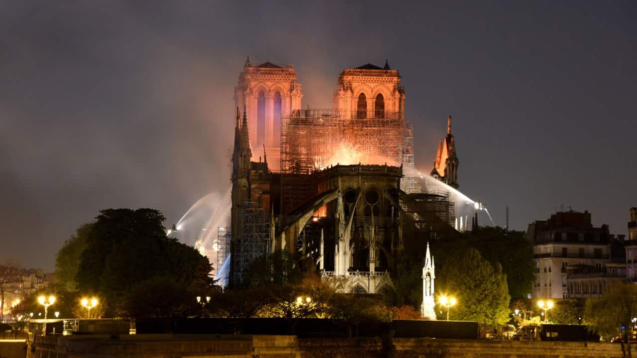 A huge fire swept through the roof of the famed Notre-Dame Cathedral in the French capital, sending flames and huge clouds of grey smoke billowing into the sky.