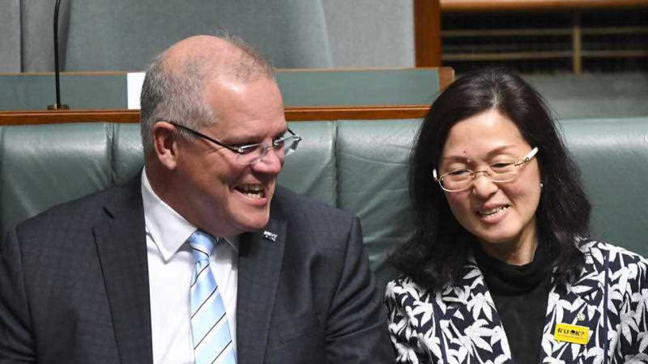 Australian Prime Minister Scott Morrison (left) sits next to Liberal member for Chisholm Gladys Liu.