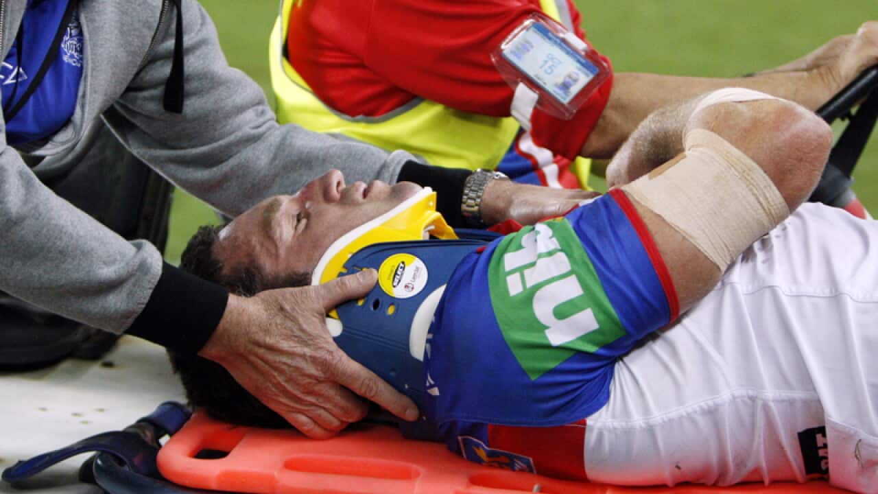 Danny Buderus is stretchered from the field.