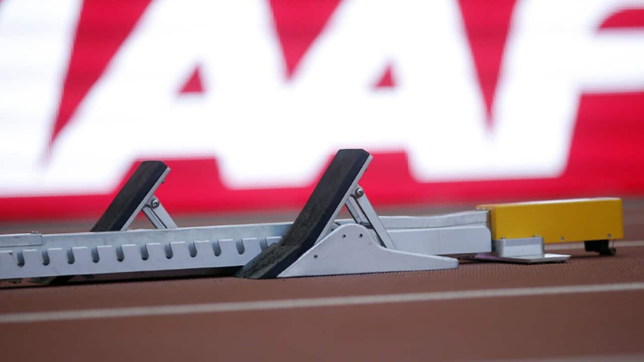 A starting block in front of an IAAF logo