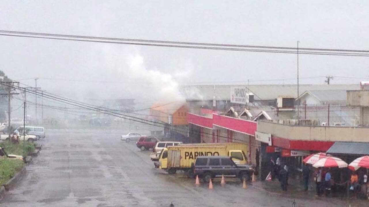 Teargas fired by police in Alotau.