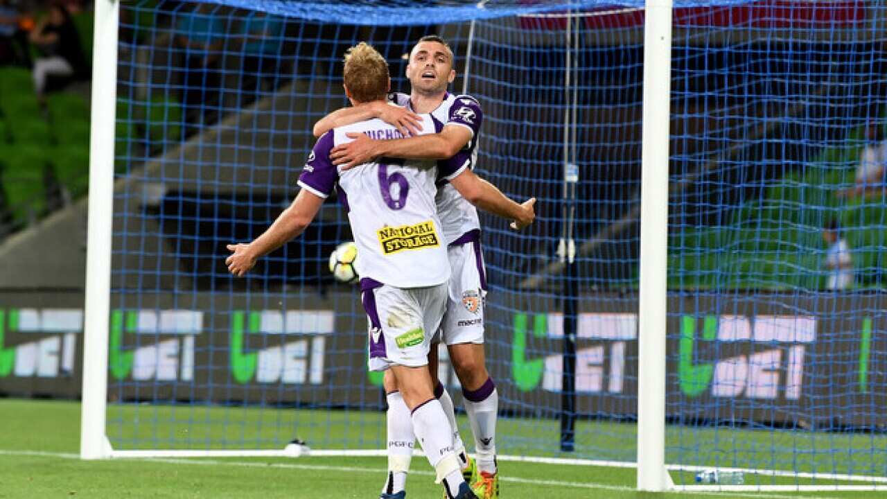 Mitchell Mallia of Perth Glory celebrate with team-mate Mitch Nichols during the round 8 A-League match between Melbourne City FC and Perth Glory.