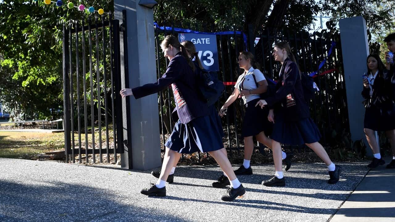 School students arrive for the first day of face-to-face schooling in Brisbane, 11 May.