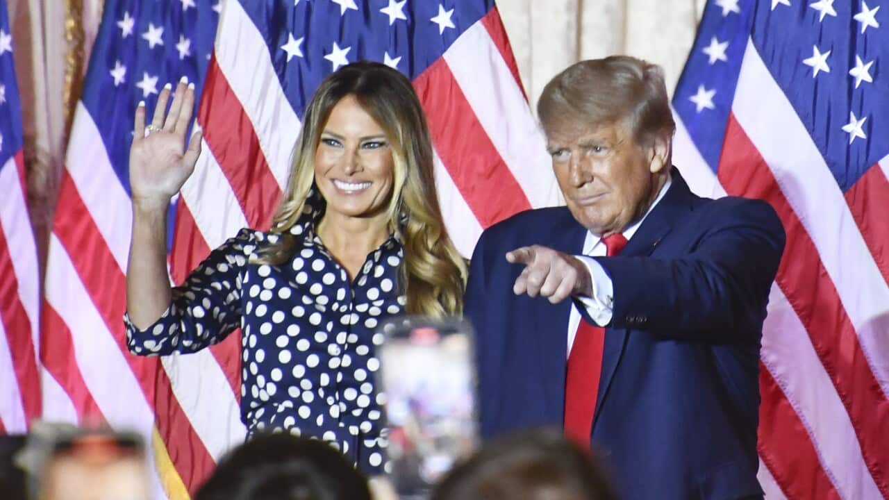 Former U.S. President Donald Trump stands with his wife Melania in front of a crowd at Mar-a-Lago in Palm Beach, Florida, on Nov. 15, 2022. Trump declared his bid to return to the White House in the 2024 presidential election.