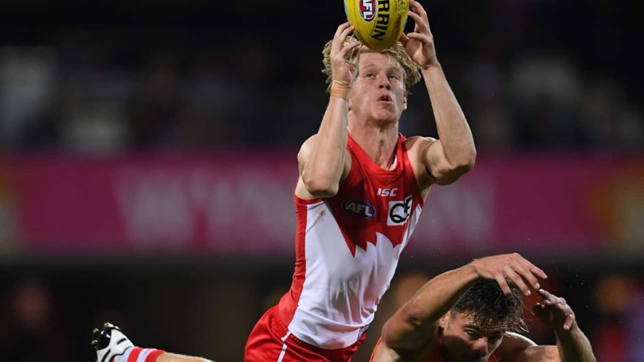 Sydney Swans player Callum Mills takes a mark