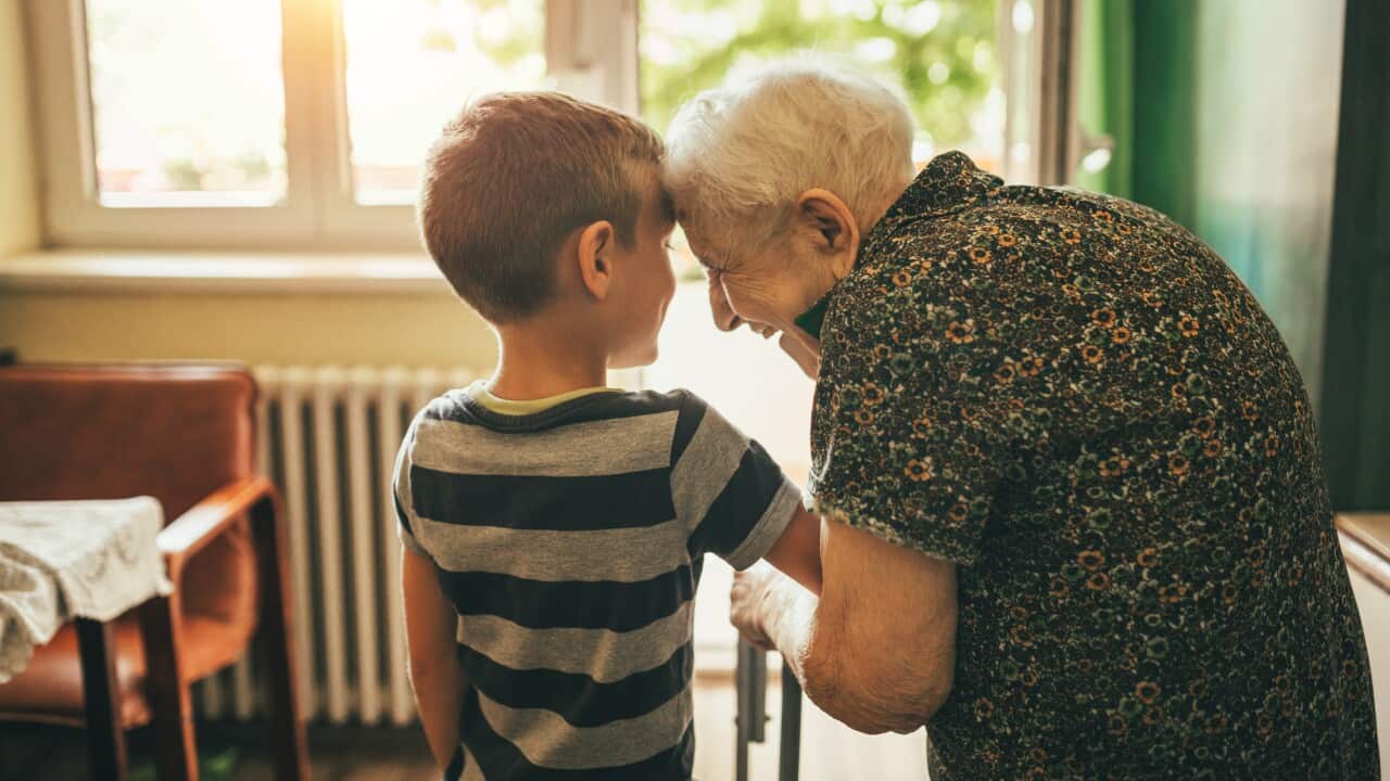 Grandson visiting his granny in nursery