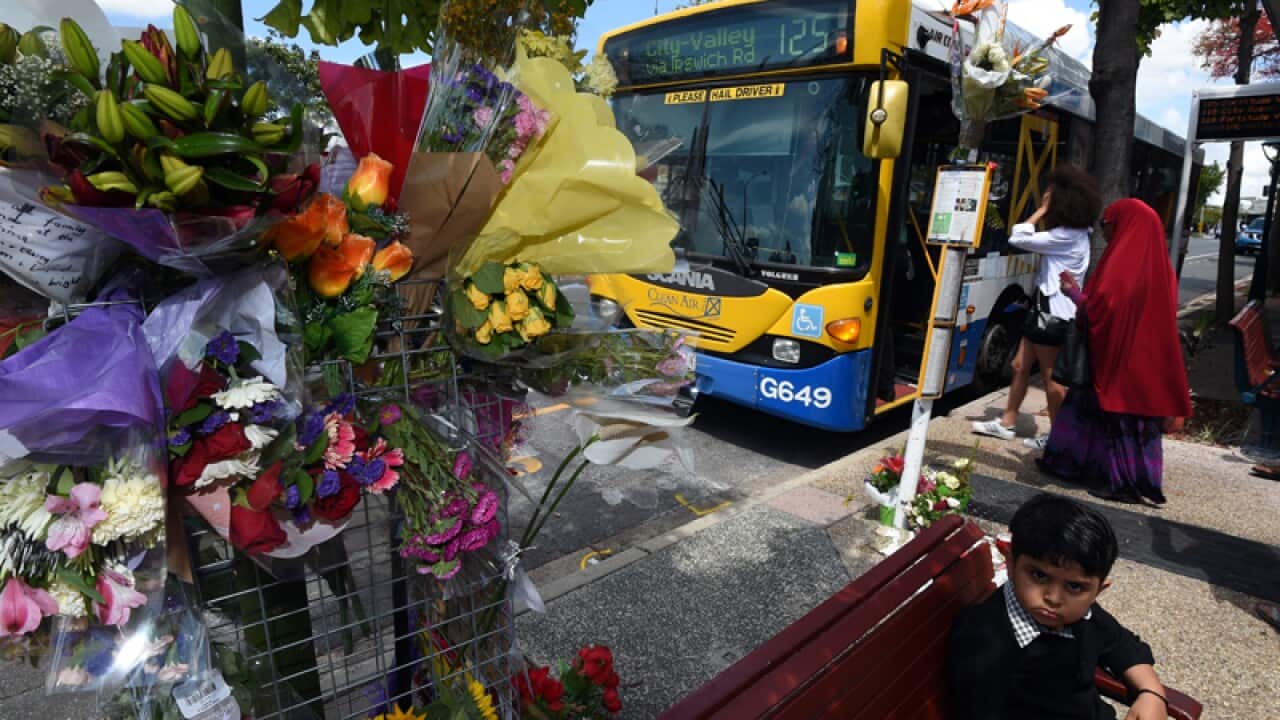 A floral tribute is seen at a bus stop in Morooka