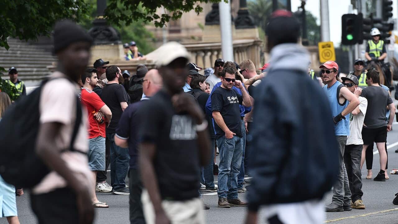 African-Australian youth are seen at a True Blue Crew and United Patriots Front rally to celebrate Donald Trump's election to the U.S. Presidency at State parliament in Melbourne, Sunday, Nov. 20, 2016. (AAP Image) NO ARCHIVING