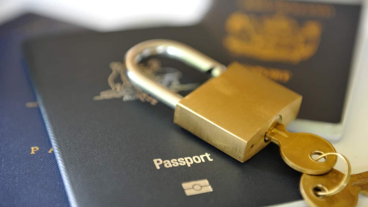 passport with a lock and key on top