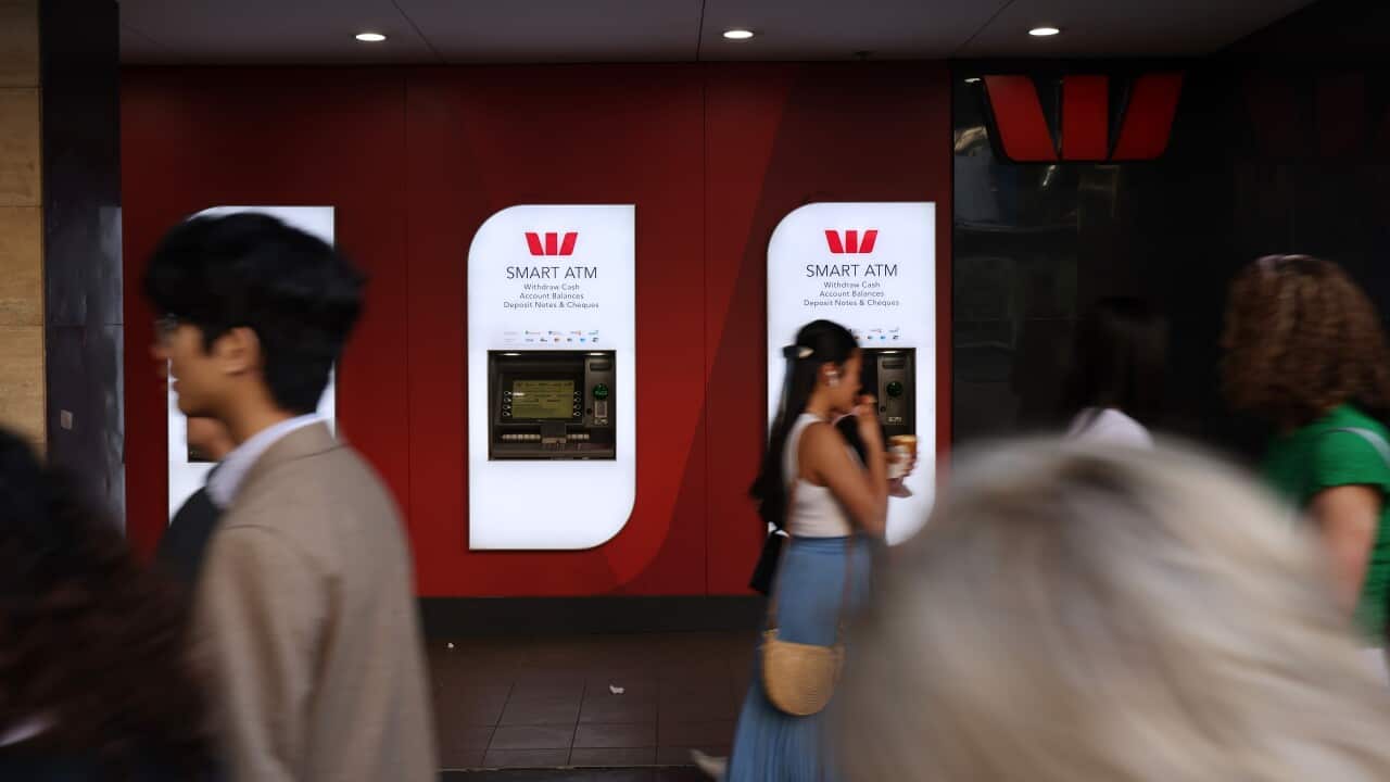 People walk past Westpac ATMs in Melbourne
