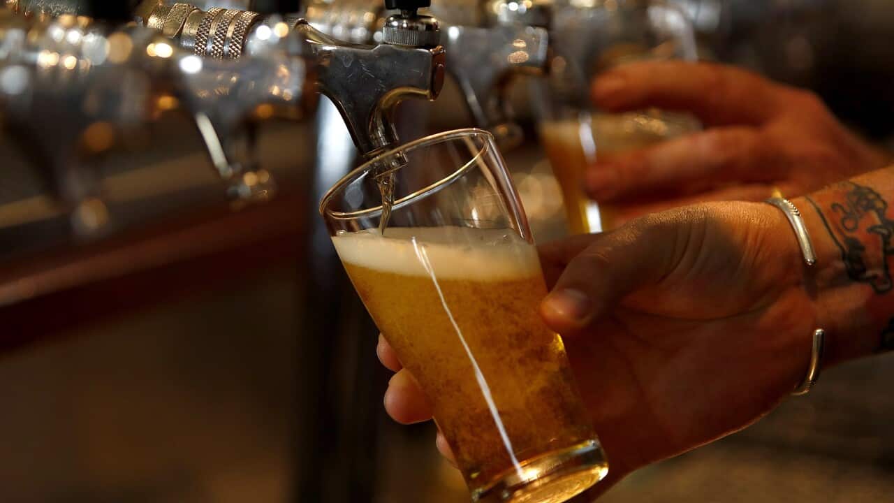 A beer is poured at a brewery