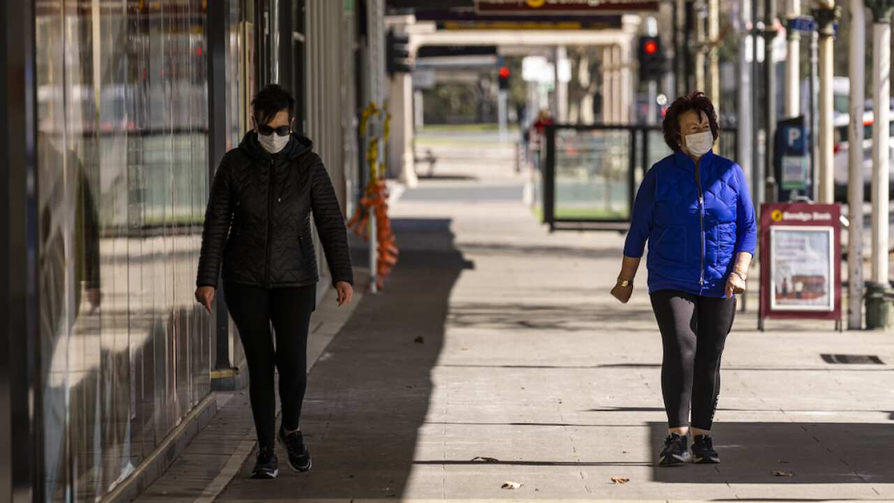 People are seen walking in Shepparton, Victoria, where lockdowns remain.
