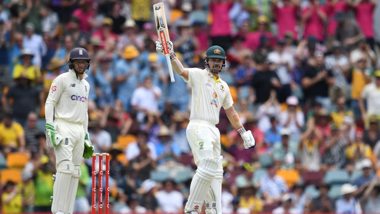 Travis Head celebrates 150 runs during day three of the First Ashes Test between Australia and England at The Gabba in Brisbane.