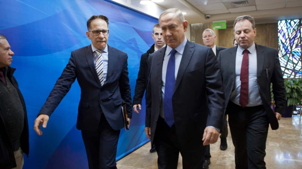 Israeli Prime Minister Benjamin Netanyahu, second right, arrives for a weekly cabinet meeting in Jerusalem, Sunday, Dec. 25, 2016.