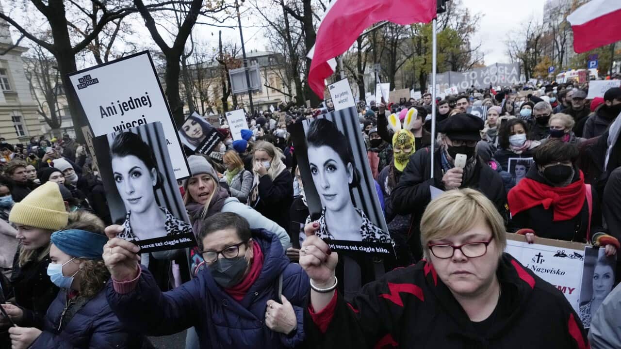 Demonstrators protest against Poland's restrictive abortions laws outside Poland's Constitutional Tribunal in Warsaw, 6 November 2021.