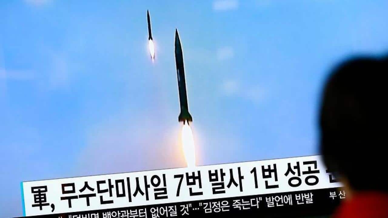 South Koreans watch a television news broadcast at a station in Seoul, South Korea, 16 October 2016