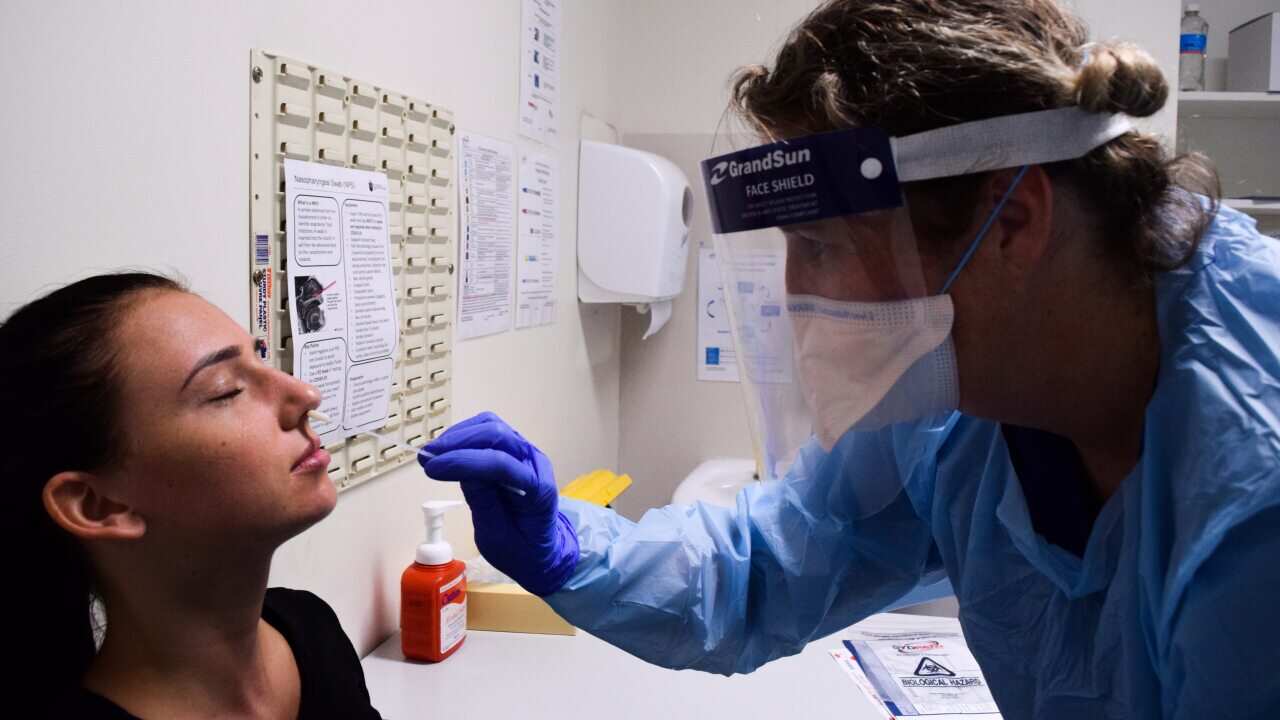 A woman is tested for coronavirus at St Vincent's Hospital in Sydney.