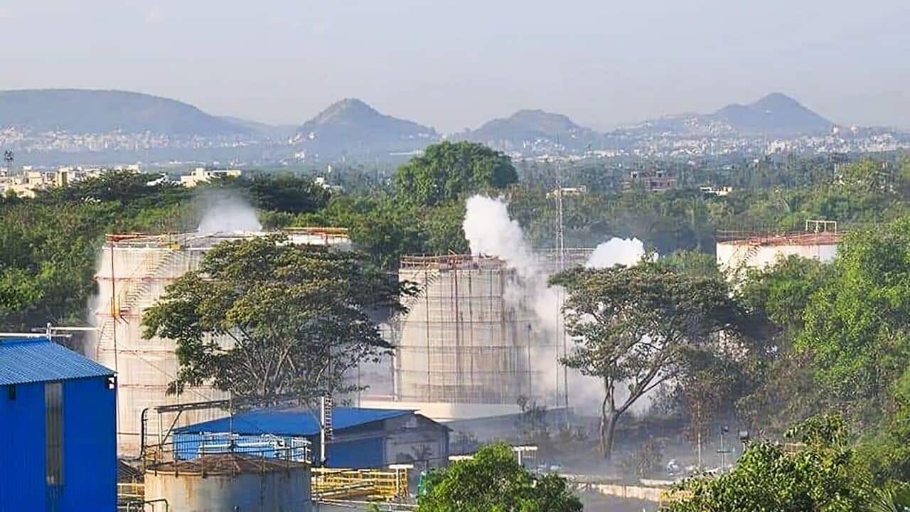 Smokes rise from an LG Polymers plant following a gas leak incident in Visakhapatnam on May 7, 2020.