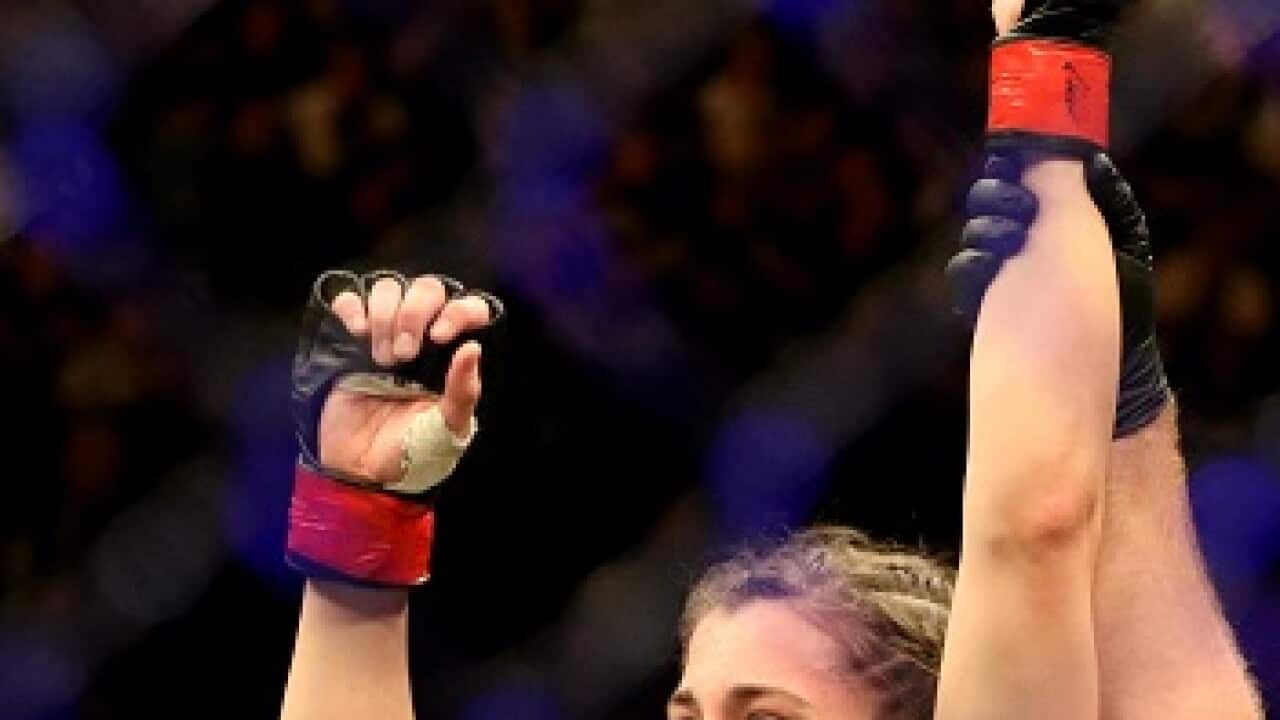 Feb 9, 2019; Melbourne, Australia; Montana De La Rosa (red gloves) defeats Nadia Kassem (blue gloves) during UFC 234 at Rod Laver Arena. Mandatory Credit: Jasmin Frank-USA TODAY Sports/Sipa USA.
