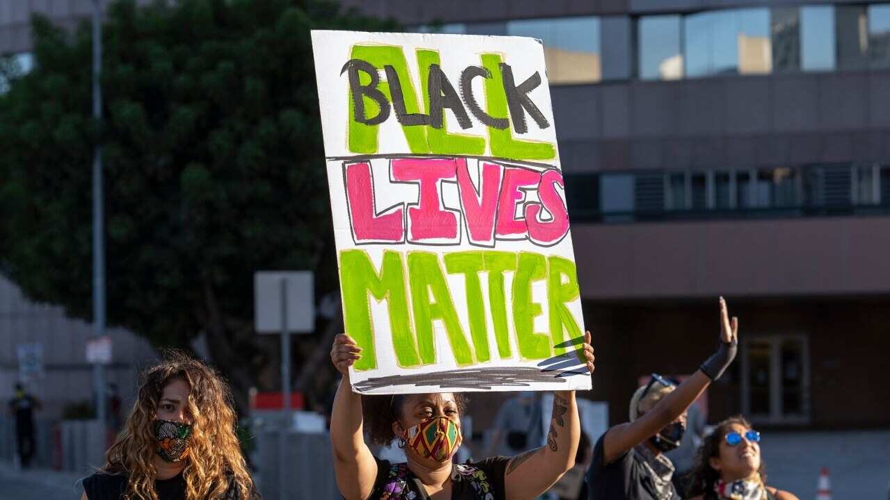Demonstrators participating in an anti-police brutality protest in Los Angeles following the killing of George Floyd in Minnesota by a white police officer.
