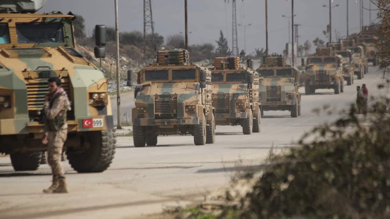 Turkish military convoy drives in Idlib province, Syria, Saturday, Feb. 22, 2020. A Turkish soldier was killed in Syria's northwest Idlib province, state-run Anadolu news agency reported Saturday. (AP Photo/Ghaith Alsayed)