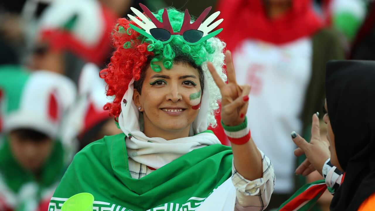 Female football fans show their support ahead of the FIFA World Cup Qualifier match between Iran and Cambodia at Azadi Stadium in Tehran, Iran.