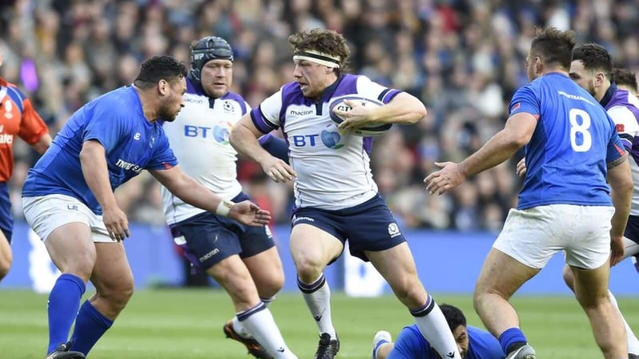 Scotland's Hamish Watson breaks the Samoa line.