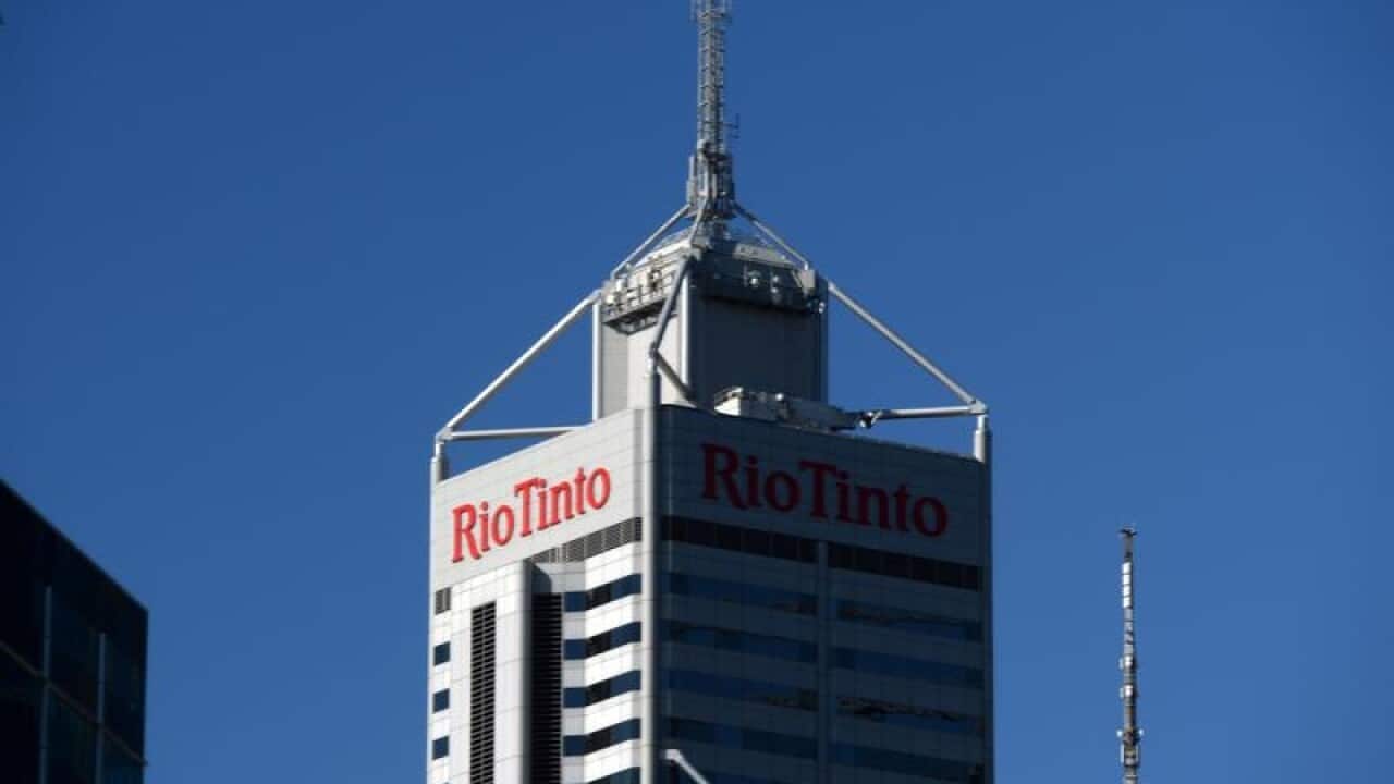 The logo of miner Rio Tinto is seen on an office tower.